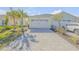 Two-story home with attached two-car garage and landscaped yard at 906 Coral Reef Way, Daytona Beach, FL 32124