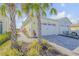 Two-story home with attached two-car garage and paved walkway at 906 Coral Reef Way, Daytona Beach, FL 32124