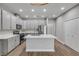 Modern kitchen with island and stainless steel appliances at 906 Coral Reef Way, Daytona Beach, FL 32124