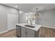 Modern kitchen with island, stainless steel appliances, and open floor plan at 906 Coral Reef Way, Daytona Beach, FL 32124
