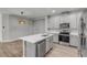 Modern kitchen with island and stainless steel appliances at 906 Coral Reef Way, Daytona Beach, FL 32124