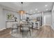 Modern kitchen with island, stainless steel appliances, and dining area at 906 Coral Reef Way, Daytona Beach, FL 32124