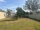 Backyard with a privacy fence and mature trees at 2776 Spicebush Loop, Apopka, FL 32712