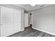 Bedroom with grey walls, wood-look floors, and ceiling fan at 10 Cedar Tree Dr, Ocala, FL 34472