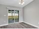 Bright dining room with sliding glass doors leading to the backyard at 10 Cedar Tree Dr, Ocala, FL 34472