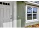 White front door and window with light green walls and trim at 10 Cedar Tree Dr, Ocala, FL 34472