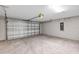 Spacious garage with high ceilings and concrete floor at 10 Cedar Tree Dr, Ocala, FL 34472