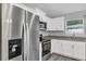 Stainless steel appliances and granite countertops in this modern kitchen at 10 Cedar Tree Dr, Ocala, FL 34472