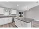 Spacious kitchen with an island, granite countertops, and white cabinets at 10 Cedar Tree Dr, Ocala, FL 34472