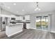 Modern kitchen with white cabinets, granite countertops, and stainless steel appliances at 10 Cedar Tree Dr, Ocala, FL 34472