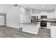 Modern kitchen with island and stainless steel appliances at 10 Cedar Tree Dr, Ocala, FL 34472
