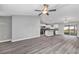 Open concept living room and kitchen with grey flooring and a center island at 10 Cedar Tree Dr, Ocala, FL 34472