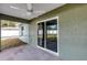 Spacious screened porch with sliding glass doors and ceiling fan at 10 Cedar Tree Dr, Ocala, FL 34472
