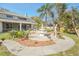 Landscaped backyard with fountain and patio at 10125 Foxhurst Ct, Orlando, FL 32836