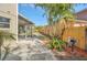 Landscaped backyard with grill and screened patio at 10125 Foxhurst Ct, Orlando, FL 32836