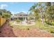 Large backyard with fountain and house view at 10125 Foxhurst Ct, Orlando, FL 32836