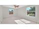 Bedroom with carpet, ceiling fan and large window at 10125 Foxhurst Ct, Orlando, FL 32836