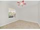 Bright bedroom with tile floors and ceiling fan at 10125 Foxhurst Ct, Orlando, FL 32836