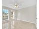Spacious bedroom with large windows and tile floors at 10125 Foxhurst Ct, Orlando, FL 32836