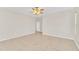 Large bedroom with ceiling fan and tile flooring at 10125 Foxhurst Ct, Orlando, FL 32836
