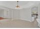 Open dining area with views into kitchen and adjacent room at 10125 Foxhurst Ct, Orlando, FL 32836
