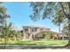 Two-story house with a landscaped lawn and driveway at 10125 Foxhurst Ct, Orlando, FL 32836