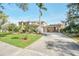 House exterior showcasing a driveway and gated entrance at 10125 Foxhurst Ct, Orlando, FL 32836