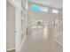 Bright Gathering room with tiled floors, fireplace and view to backyard at 10125 Foxhurst Ct, Orlando, FL 32836