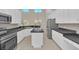 Spacious kitchen with island, stainless steel appliances, and ample counter space at 10125 Foxhurst Ct, Orlando, FL 32836