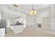 Open concept kitchen with island and stainless steel appliances flows into a large Gathering room at 10125 Foxhurst Ct, Orlando, FL 32836
