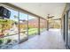 Spacious screened patio overlooking a lush backyard with fountain at 10125 Foxhurst Ct, Orlando, FL 32836