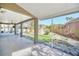 Bright screened patio with access to backyard and fountain at 10125 Foxhurst Ct, Orlando, FL 32836