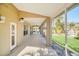 Enclosed patio with backyard views and access to the house at 10125 Foxhurst Ct, Orlando, FL 32836