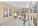 Sunroom with exercise equipment and tile floors at 10125 Foxhurst Ct, Orlando, FL 32836