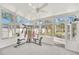Sunroom with exercise equipment and backyard view at 10125 Foxhurst Ct, Orlando, FL 32836