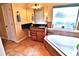 Bathroom featuring granite counters, garden tub and tiled floors at 10215 Yonaomi Cir, Clermont, FL 34711