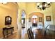 Elegant dining room with hardwood floors and chandelier at 10215 Yonaomi Cir, Clermont, FL 34711