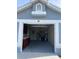 Garage with utility sink and ample storage shelving at 109 Grand Junction Blvd, Orlando, FL 32835