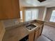 Kitchen boasts granite countertops and a breakfast bar at 11526 Westwood Blvd # 725, Orlando, FL 32821