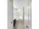 Clean bathroom with a tub, toilet and dark brown vanity at 1162 Atlantic Ave, Fruitland Park, FL 34731