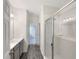 Bathroom with modern vanity, shower, and gray tile floors at 1162 Atlantic Ave, Fruitland Park, FL 34731