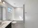 Simple bathroom with a shower/tub combo and white tile at 1162 Atlantic Ave, Fruitland Park, FL 34731