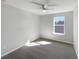 Spacious bedroom with carpeted floor and a large window at 1162 Atlantic Ave, Fruitland Park, FL 34731