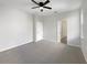 Bright bedroom with carpeted floor and ceiling fan at 1162 Atlantic Ave, Fruitland Park, FL 34731