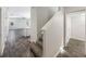 Bright entryway with stairs leading upstairs and tile flooring at 1162 Atlantic Ave, Fruitland Park, FL 34731