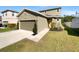 Two-story house with attached garage and well-maintained lawn at 1162 Atlantic Ave, Fruitland Park, FL 34731