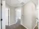 Upstairs hallway with doors to bedrooms and a staircase at 1162 Atlantic Ave, Fruitland Park, FL 34731