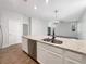 Modern kitchen features a large island with granite countertops and stainless steel appliances at 1162 Atlantic Ave, Fruitland Park, FL 34731