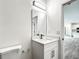 Clean bathroom with white vanity and a view of the kitchen at 13566 Sw 79Th Terrace Rd, Ocala, FL 34473