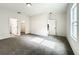 Bright bedroom with carpet flooring and en-suite bathroom at 13566 Sw 79Th Terrace Rd, Ocala, FL 34473